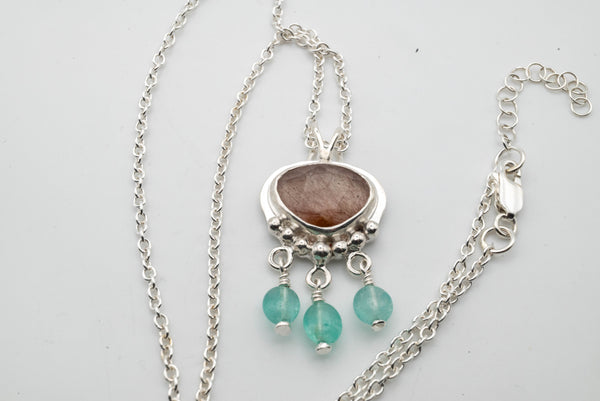 Handmade silver necklace with Copper Rutile and Emerald