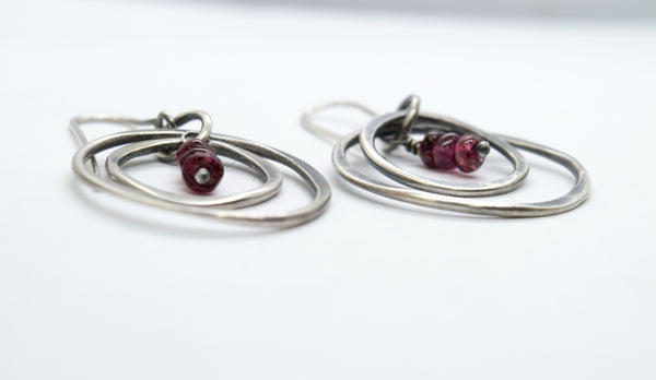 Silver earrings with red garnet