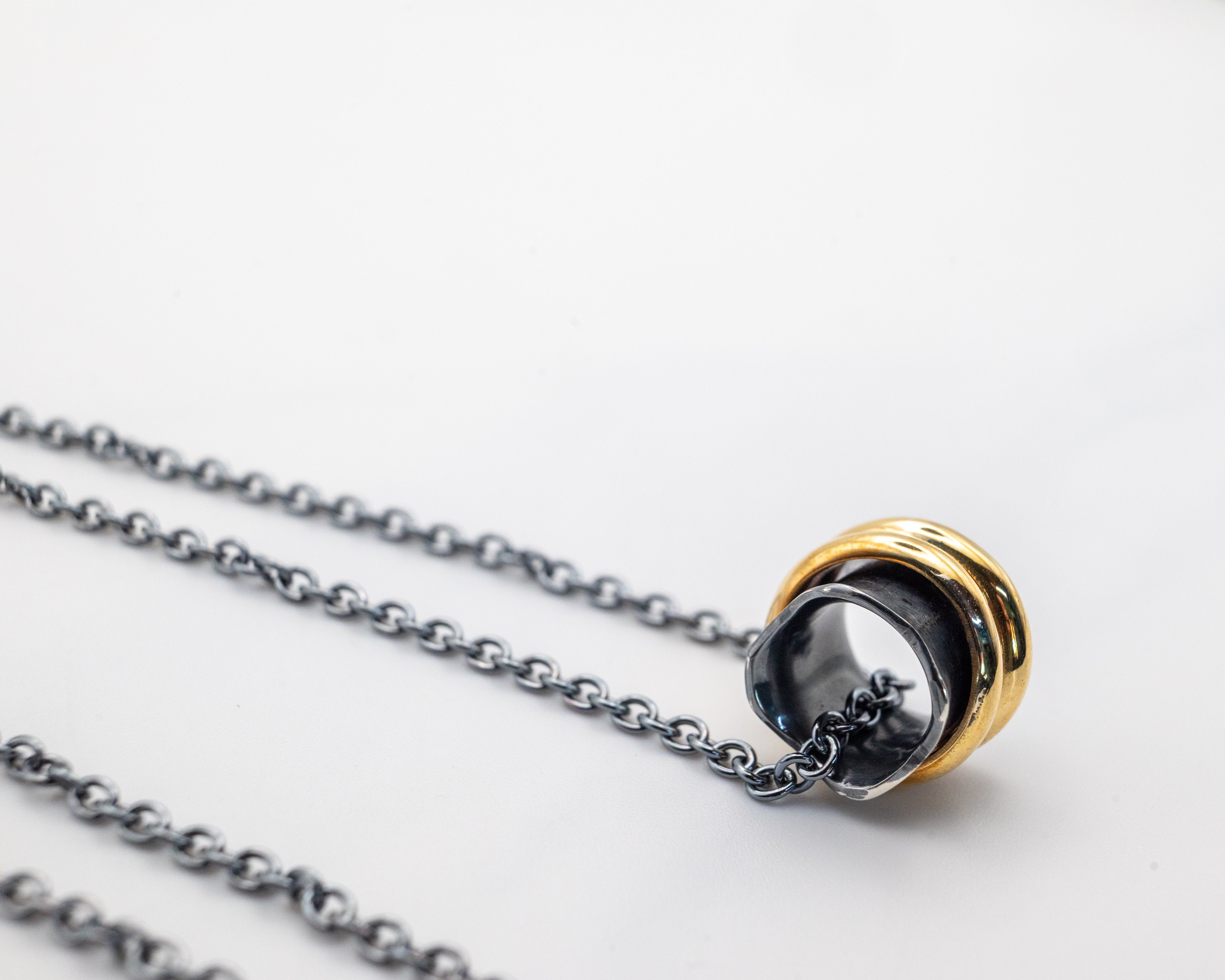 Handmade spinner necklace in 925 silver and brass