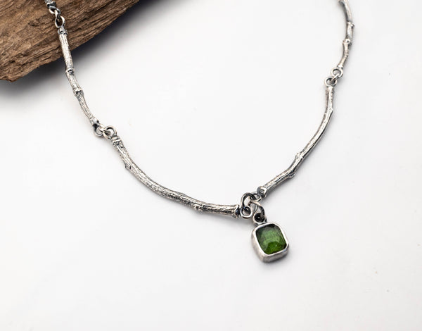 artisan silver necklace with organic leaf and branch texture