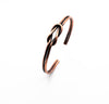 Handmade copper bracelet with the knot of love