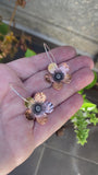 Copper and silver earrings.