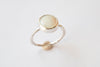 Silver ring with mother-of-pearl stone.