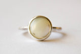 Silver ring with mother-of-pearl stone.