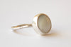 Silver ring with mother-of-pearl stone.